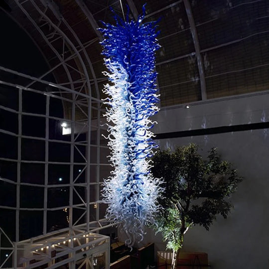 Grande suspension bleue en verre soufflé à la main, lustre long avec éclairage LED, idéale pour un hôtel, un hall, un salon ou un loft.
